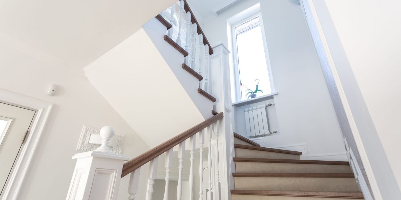 Custom staircase design and installation in Naples, FL by Steele Design Solutions—modern, traditional, and space-saving styles for residential interiors.