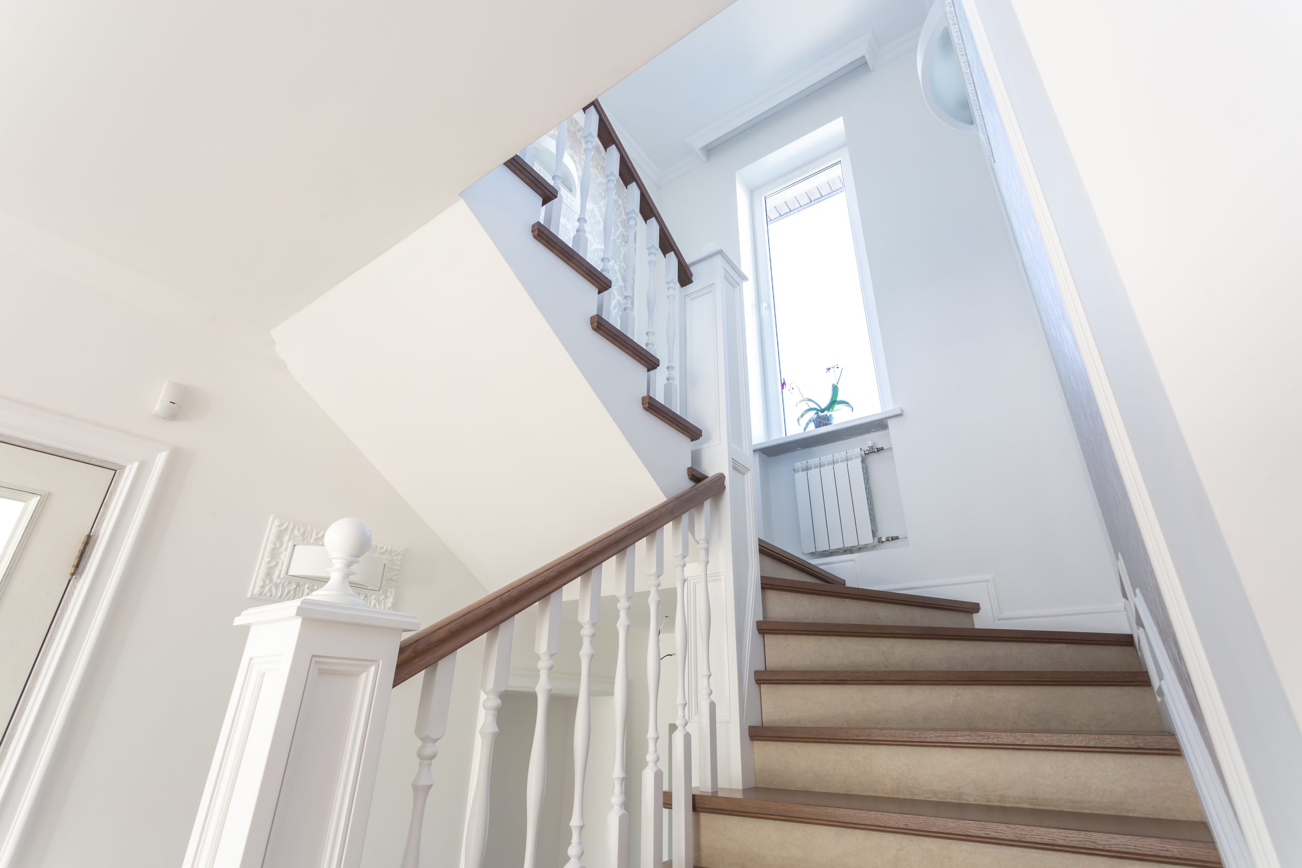 Custom staircase design and installation in Naples, FL by Steele Design Solutions—modern, traditional, and space-saving styles for residential interiors.