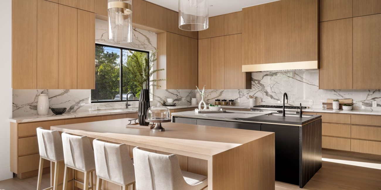 Interior design by Steele Design Solutions in Naples, FL featuring mixed metal finishes in a modern kitchen and bathroom renovation.