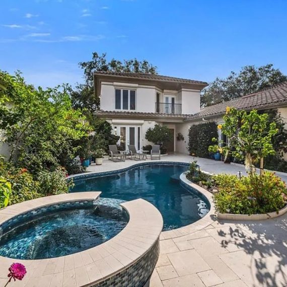 Beautiful outdoor courtyard with elegant landscaping designed by Steele Design Solutions in Naples FL.